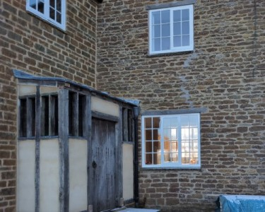 Lime mortar repointing on heritage Northamptonshire ironstone wall