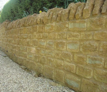 Stone boundary wall and garden paving restoration